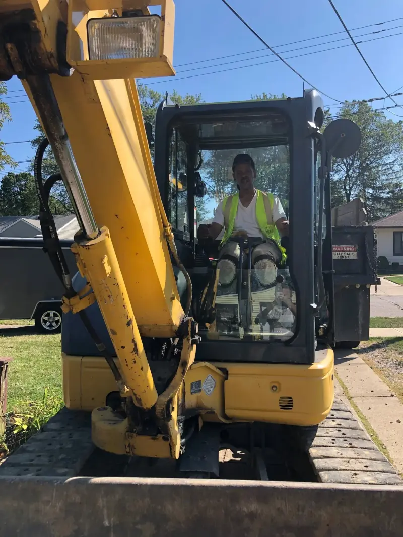 FatirGroup equipment operator seated in an excavator